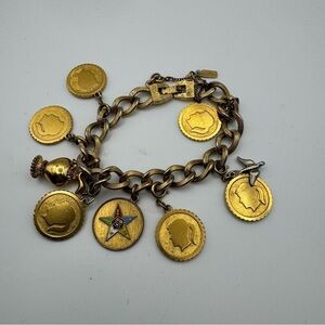 Vintage Monet Gold Tone Charm Bracelet with 9 Charms Easter Star Safety Chain